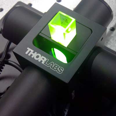 Cuvette holder with cuvette emitting fluorescence.